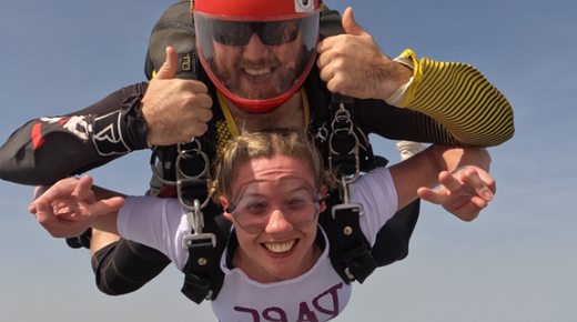 Woman and a man mid-air doing a sky dive to raise money for Rape Crisis England & Wales