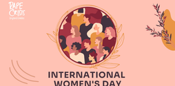 Illustrated women are drawn in a circle all looking to the right. The image has a blush pink background with 'International Women's Day' written underneath the illustrated women.