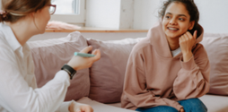 Young woman talks to a counsellor - smaller version